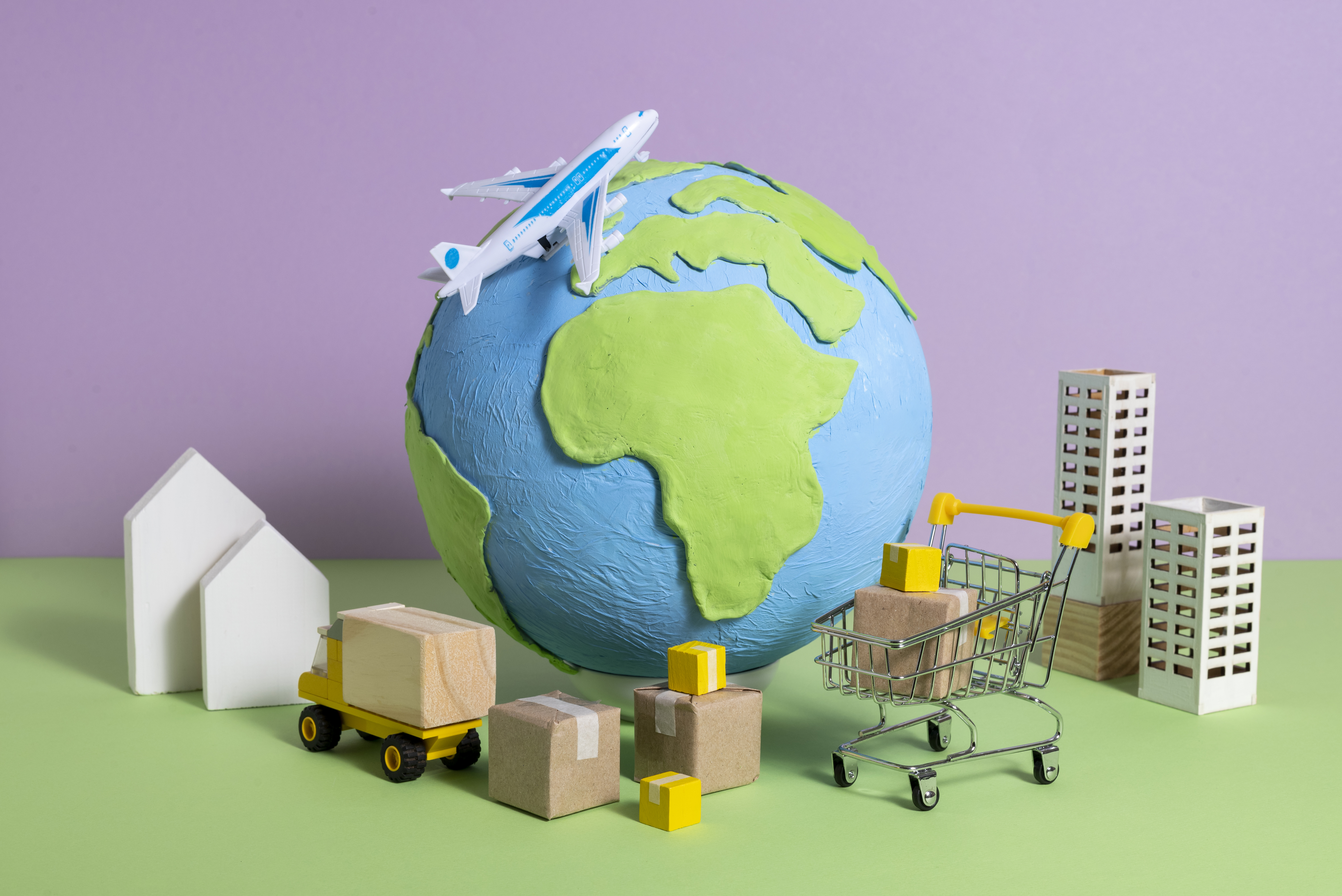 Globe surrounded by supply chain figurines