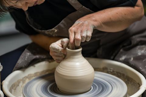 woman working on a potter's wheel