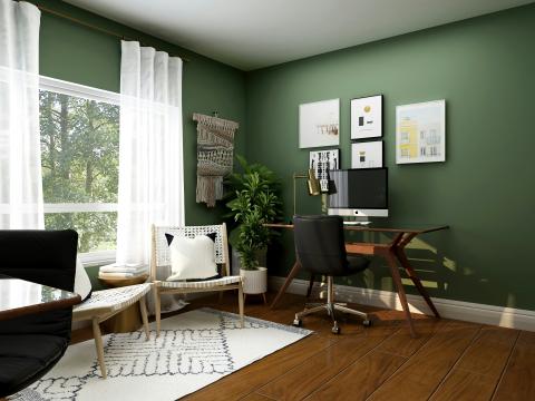 A home office with dark green walls, white curtains and small rug. 