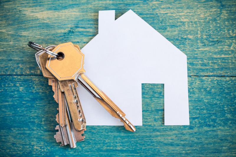 House keys and a paper cut out shaped like a house