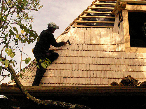 Man fixing roof